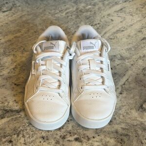 White toddler girl pumas